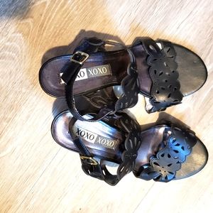 Black leather wedge sandals.